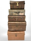 Three antique tin trunks and two canvas luggage cases,