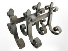 A pair of wrought iron fire dogs, height 25 cm.