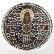 An early 20th century stained painted and leaded glass circular window,