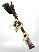 A bundle of fishing rods, landing net, three reels.