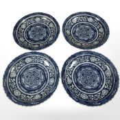 A set of four oriental blue and white scalloped edge bowls, diameter 36 cm.