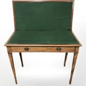 A mahogany turnover top card table, fitted a drawer,