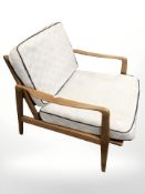 An Ercol stained elm lounge armchair.