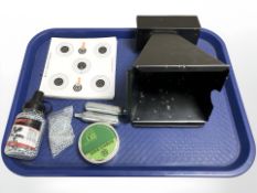 An air rifle / BB gun metal pellet catcher, with a quantity of paper targets, two gas canisters,