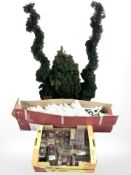 A Christmas tree and quantity of baubles,