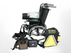 A Karma folding wheelchair and a TGA leisure motorised kart with charger and battery pack.