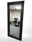 A contemporary stitched leather full length mirror,