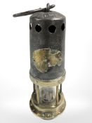 A 19th century brass and steel miner's lamp by W. E.