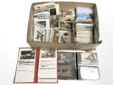 A collection of antique and later postcards, loose and in albums.