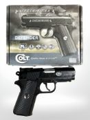 A Colt Defender metal-framed .177 caliber CO2 powered steel BB gun, in original box.