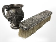 An embossed silver jug, Sheffield marks, height 8 cm,