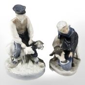A Royal Copenhagen figure of a shepherd and two sheep and a further figure of a woman and calf,