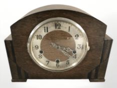 An Art Deco oak eight day mantle clock, height 22 cm.