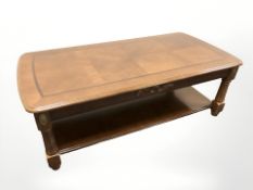 A reproduction two tier coffee table,