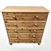 A contemporary pine five drawer chest, 83 cm x 43 cm x 89 cm.