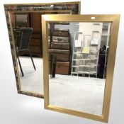 A gilt mirror and a similar mirror with floral frame, 92 cm x 72 cm.
