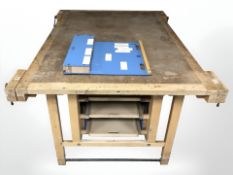 A 20th century workbench, fitted with vices, 150 cm x 110 cm x 80 cm.