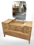 A 20th century Lebus oak sunk-centre mirror back dressing table,