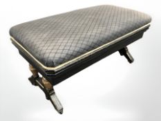 A Victorian ebonised and gilt rectangular storage stool, 97 cm wide.