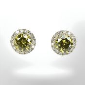 A pair of 14ct gold yellow diamond stud earrings,