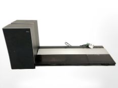 A Bang and Olufsen Beocenter 2200, with lead, and a pair of Beovox X25 speakers.