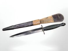A Fairbairn-Sykes Third Pattern commando fighting knife, with ribbed grip and 16.