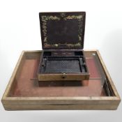 A table top display cabinet and an embossed leather writing box.
