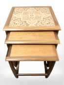A G Plan nest of three tiled inset top tables,