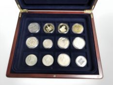 A coin collectors box containing commemorative crowns, five pound and five shilling coins, etc.