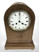 An Edwardian inlaid mahogany eight day domed mantle clock, retailed by De Carle Brothers, London,