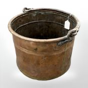 A 19th Century copper bucket, with a cast iron swing handle.