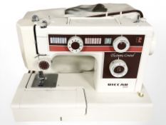 A Riccar 695E electric sewing machine with lead and pedal