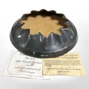 A loaded silver bottle stand, marked P & O Aurora World Cruise 2001, with accompanying certificate,