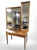 A contemporary two drawer side table, two pine framed mirrors and a pine topped wrought metal table.