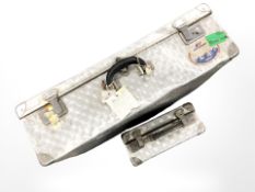 Two vintage aluminium luggage cases, largest 70 cm wide.