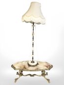 A gilt brass and onyx topped coffee table and similar standard lamp
