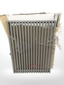 An 800 mm x 600 mm silvered finish radiator, in packaging.