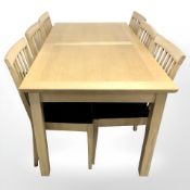 A contemporary oak extending dining table,