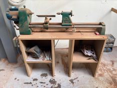 A Coronet 220/240v wood turning lathe on mdf stand, with a small quantity of lathe tools,