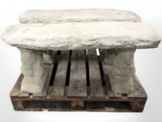 A concrete garden bench on squirrel supports,