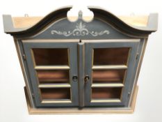 A reproduction painted and gilt glazed wall cabinet, width 85 cm.