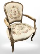 A continental carved beech salon armchair.