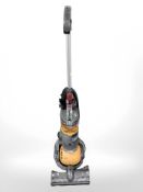 A Dyson DC24 upright vacuum.
