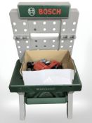 A child's Bosch workbench and tools.