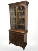 A late Victorian glazed mahogany bookcase, 91 cm x 47 cm x 210 cm.