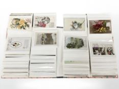 An album containing approximately 176 antique and later postcards, birthday cards, greeting cards,