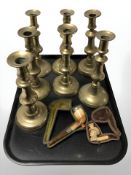 Two Meerschaum pipes and a group of seven Victorian brass candlesticks.
