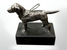 A heavy cast metal model of a labrador guide dog, standing on slate plinth, height 13.5 cm.