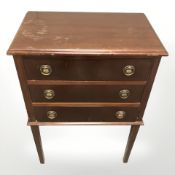 A 20th century stained teak three drawer low chest, width 50 cm.