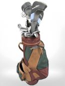A golf bag containing assorted irons and drivers including Yamato, Delta, Arrow, etc.